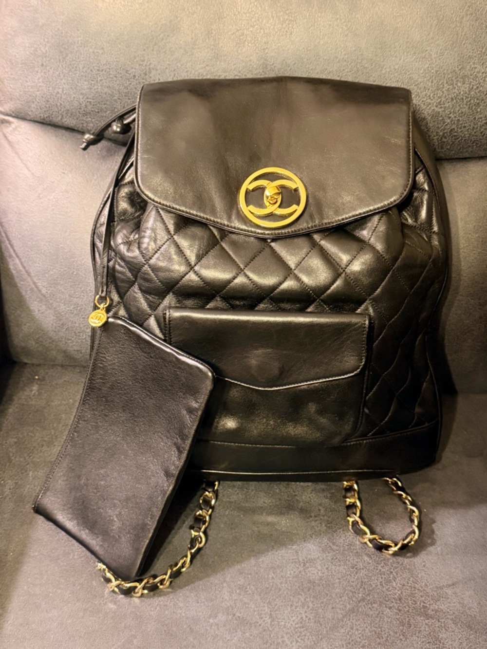 Vintage CHANEL Black Quilted Leather Backpack with Gold CC Medallion
